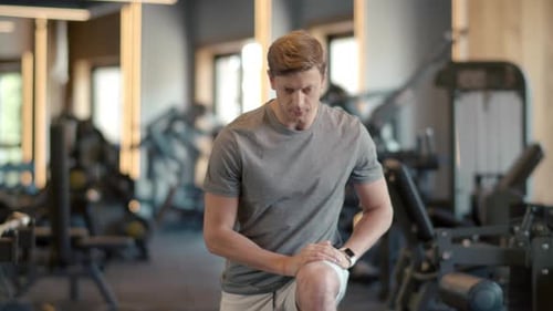 Sport Man Warm Up in Fitness Club. Closeup Attractive Bodybuilder Warming Up