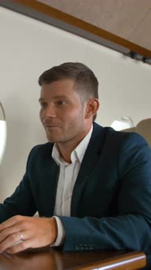 Corporate Team Working Together on Private Airplane