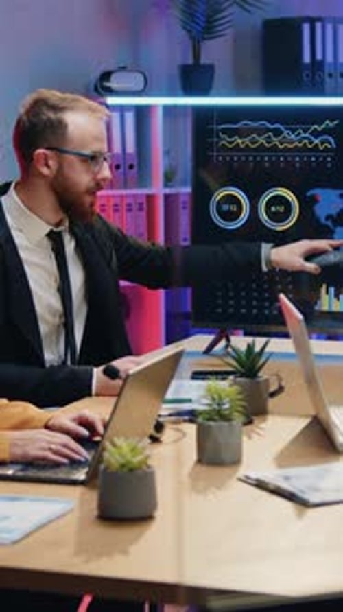Goodlooking Purposeful Persistent Professional Male and Female Office Workers Sitting Around