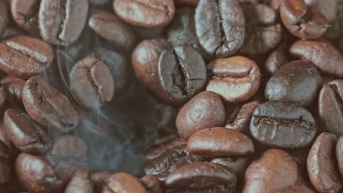 Close-up of Coffee Beans with Rising Smoke