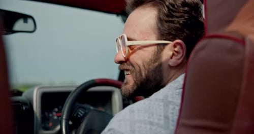 Happy, laugh and man in car on road trip, vacation and holiday for adventure in countryside