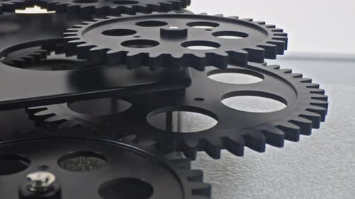 Black Gears Turning Close Up