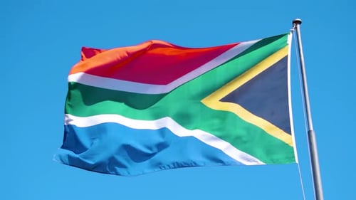 National Flag Waving Against a Clear Blue Sky