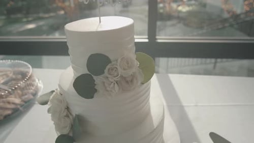 Elegant Three Tiered Wedding Cake Decorated With Flowers