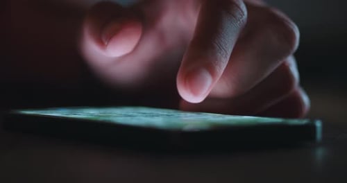 Finger scrolling on a bright smartphone screen