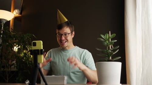 Man with Party Hat at Virtual Birthday Celebration