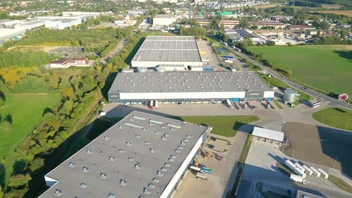 Aerial view of goods warehouse. Logistics center delivery in industrial city zone from above. Aerial