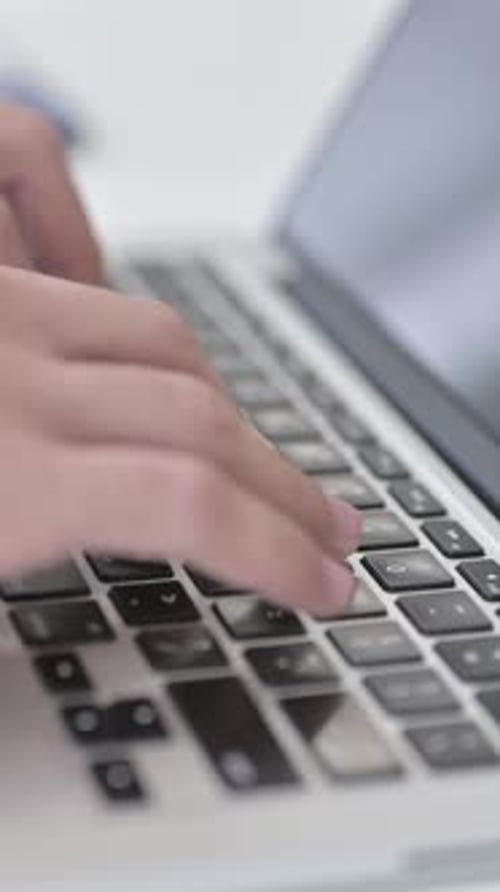 Close Up of Businessman Typing on Laptop, vertical video
