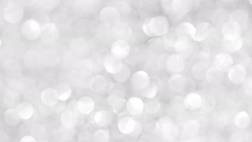 Festive glitter blurred shining silver background