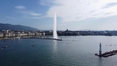 Stunning Fountain Jet d'Eau On Lake Geneva In Geneva, Switzerland. aerial pullback