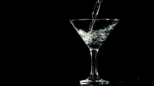 Clear Liquid Poured into Glass Martini Glass