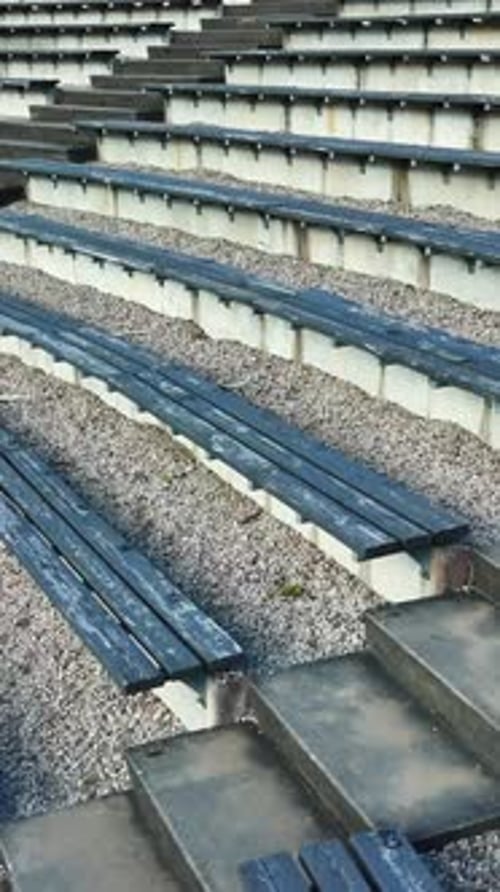 Vertical View Of Empty Bleachers Of A Sun Hill Open-Air Stage In Talsi, Latvia. Pullback Shot