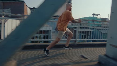Parkour Athlete Running and Doing Side Flip on Urban Bridge