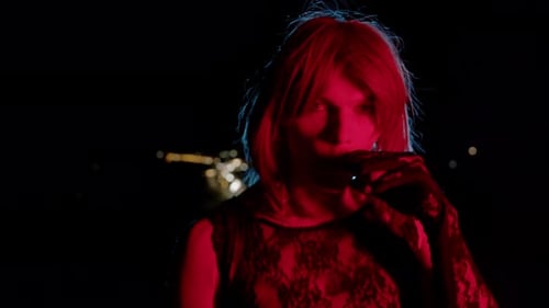 Blonde Individual Vaping in Urban Neon Nightscape