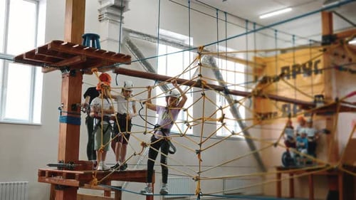 Children Enjoying Ropes Course Indoor Adventure
