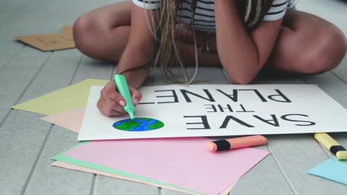 Top View Volunteer Hipster Woman an Activist Drawing a Poster with the Message Save the Planet