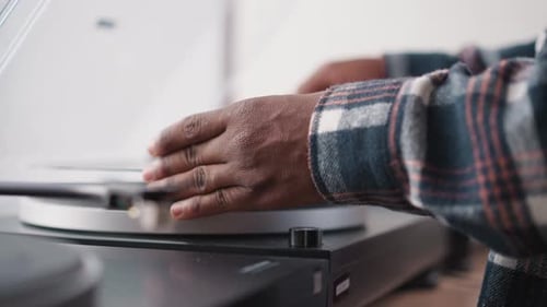 Close-up Hands Adjusting Record Player Needle