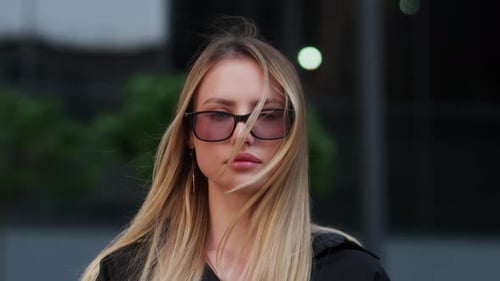 Beautiful Woman with Blonde Hair Wearing Glasses