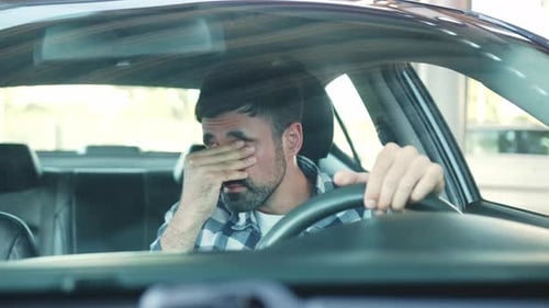 Guy Sitting in His Car and Feeling Stressed and Upset on the Road Slow Motion