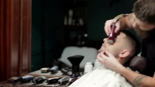 Client During Beard Shaving in Barber Shop