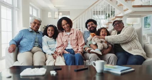 Happy Multi-Generational Family Posing on Couch