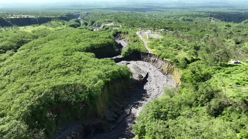 Aerial view of the valley and the paths of Mount Merapi's lava in Yogyakarta, Indonesian Volcano