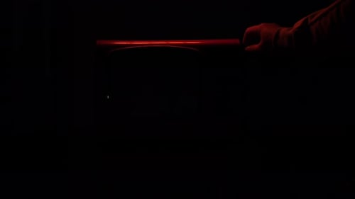 Vintage Television with Glowing Static in Dark Room