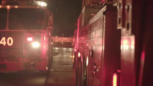 Fire Department Service Truck with Flashing Siren Lights at Night