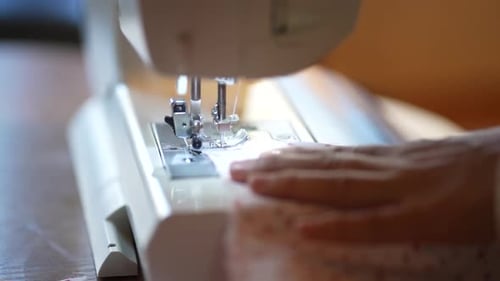 woman using a sewing machine