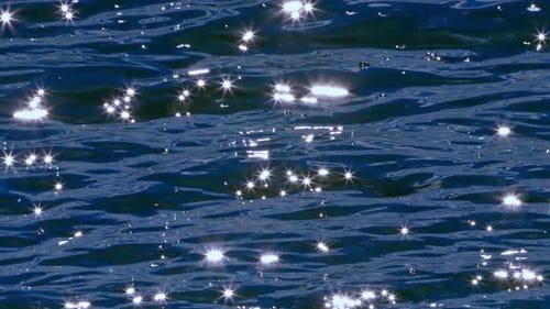 The Sun Glitter Over The Sparkle Shimmering Surface Of The Sea