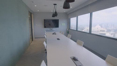 Slow Panning Shot Of A Stylish And Modern Meeting Room In A Corporate Office With A High Building Vi