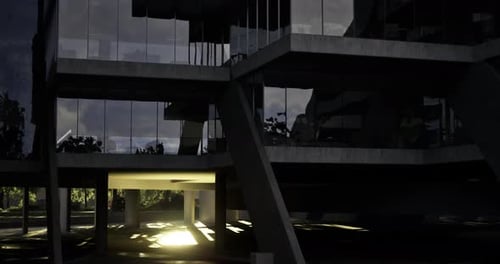 Estructura arquitectónica moderna con vidrio reflectante e iluminación intensa al anochecer