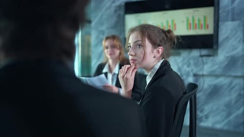 Business Meeting with Young Professionals in Modern Office