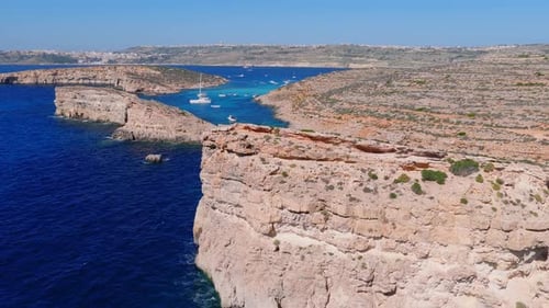 Aerial View of Comino Blue Lagoon Boats and Cliffs Malta Summer