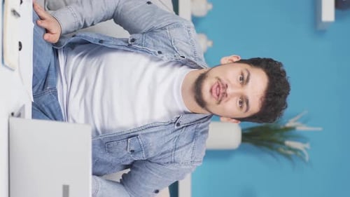 Vertical video of Man experiencing joy looking at camera.