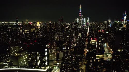 A high angle aerial view of Manhattan from over the East River in NY. It was taken on a quiet night