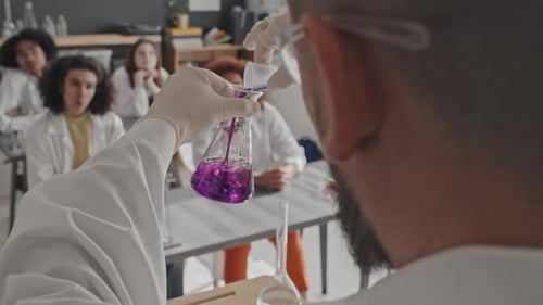 Teacher Performs Science Experiment for Students