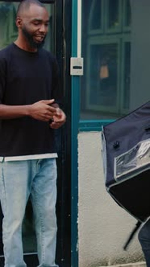 Vertical Video Confused Courier Delivering Wrong Fastfood Order to Client