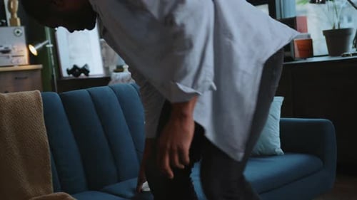 Adult Using Smartphone While Relaxing on Couch