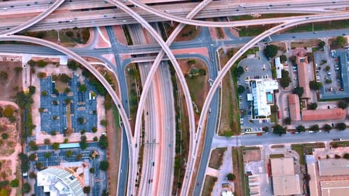 Circling over the busy roads in the big city. Complex multi-level interchange from drone footage.