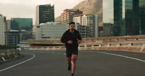 Fitness, running and man in a city street for workout, training or performance