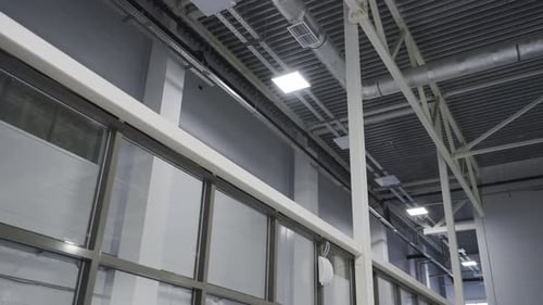 Ceiling of Warehouse Decorated with Contemporary Lamps