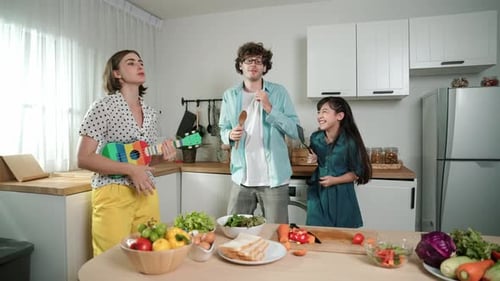 Family sings and prepares healthy food at home