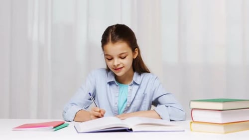 School Girl Writing Math Task to Notepad Book