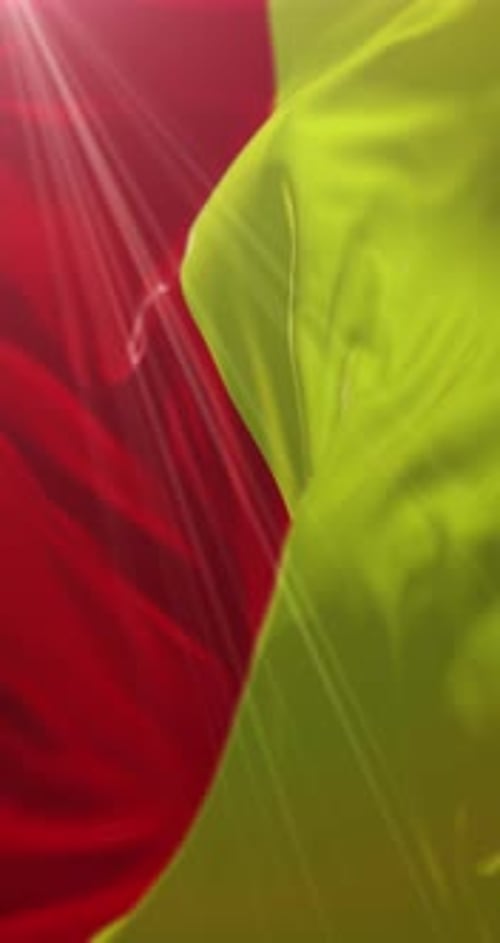 Abstract Smooth Flowing Red and Yellow Fabric Background