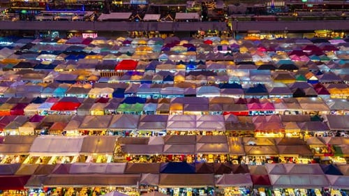 Dusk to Night Timelapse of Asian Night Market Bangkok Thailand
