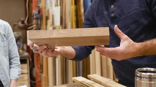 Carpenters Plan Woodworking Project in Workshop