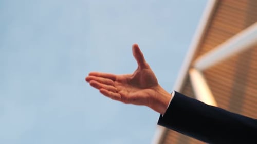 Two Business People Shaking Hands in Agreement