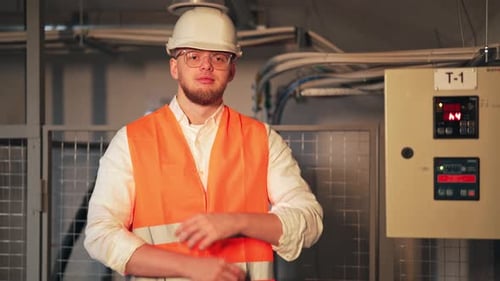 Young Man Engineer Wearing Safety Vest and Hardhat