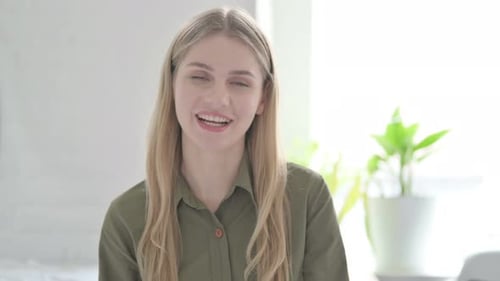 Woman with Blonde Hair Speaking and Waving Hello